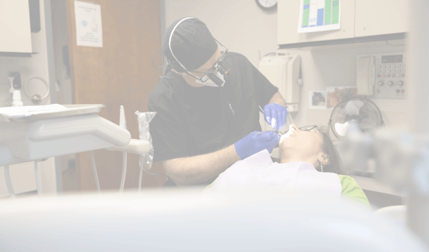 Dentist with unmated clinical expertise treating dental patient
