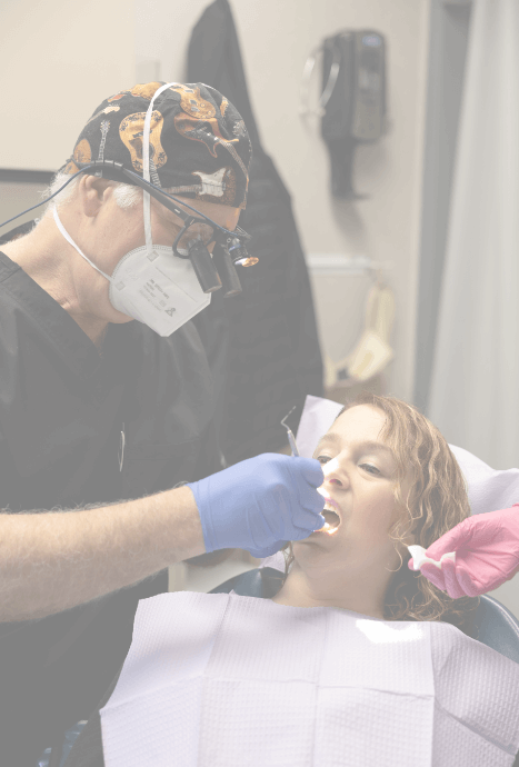 Doctor Markovits providing dental implant and cosmetic dentistry treatment